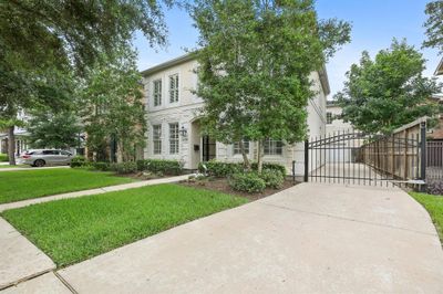 Pull into your private, gated driveway after your short commute from the Medical Center, Galleria, or Downtown and unwind under the stars in your serene backyard nestled amongst the trees. | Image 3