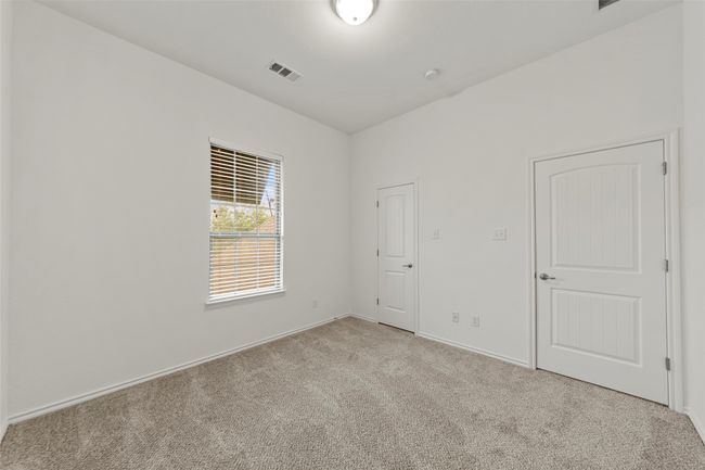 Spare room with light colored carpet, baseboards, and visible vents | Image 29