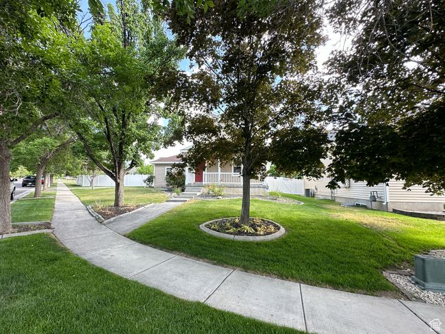 View of home's community with a yard | Image 17