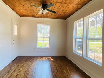 Front entry/living room. Beautifully refinished wood floors throughout | Image 2