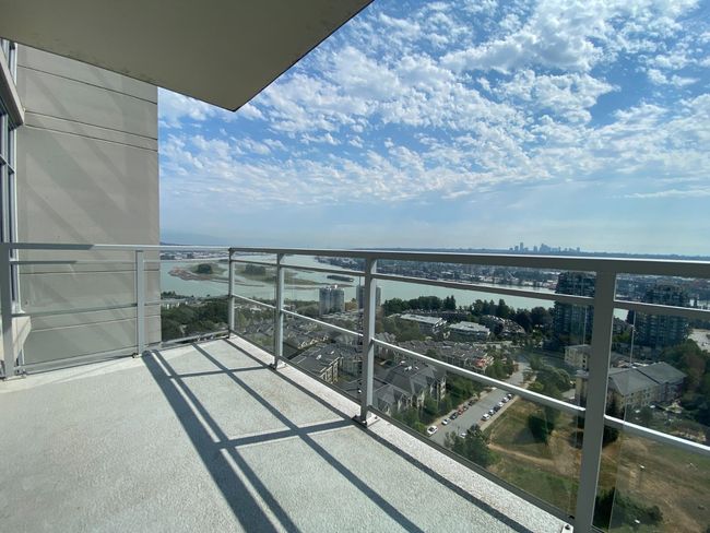Balcony featuring a water view and a view of city | Image 17
