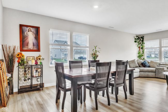 dining area featuring recessed lighting, light wood-style flooring, baseboards, and visible vents | Image 5