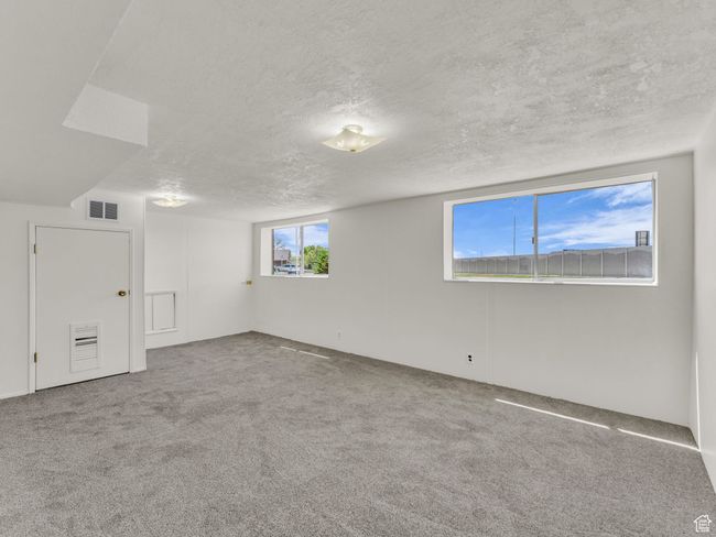 Basement with new carpet and paint. | Image 18