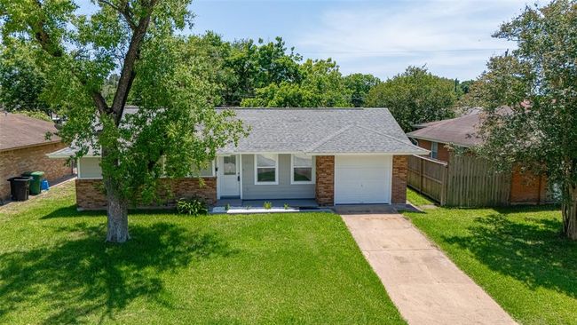 With a welcoming curb appeal, the property features a well-maintained exterior and a spacious layout designed for modern living. | Image 40