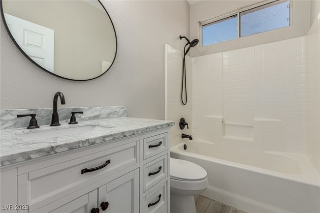 Bathroom with vanity, shower / bath combination. | Image 27