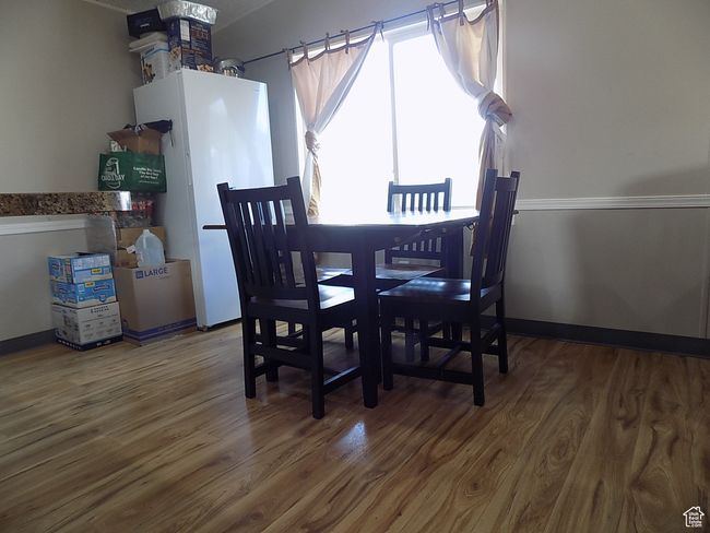 Dining space with hardwood / wood-style flooring | Image 10