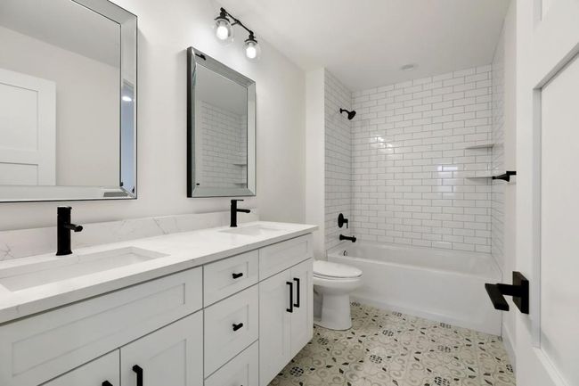2 upper level bedrooms share jack and jill bathroom. Pictures of previously built house. | Image 22