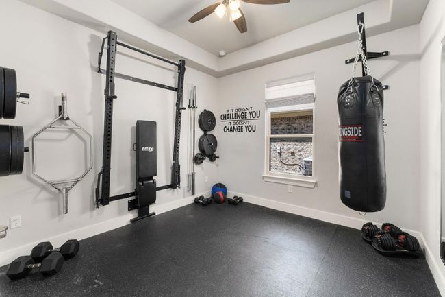 Exercise area with ceiling fan or bedroom 4 with walk in closet | Image 13