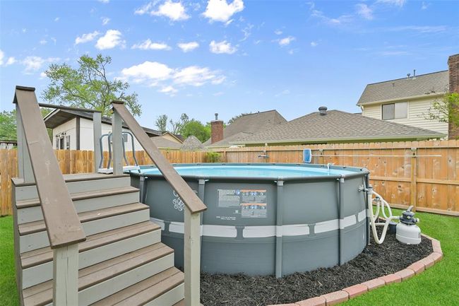 Cool off this summer in the nearly new above-ground pool with an upgraded staircase & decking and a dedicated filtration system—perfect for relaxing, entertaining, or weekend fun right at home. | Image 23