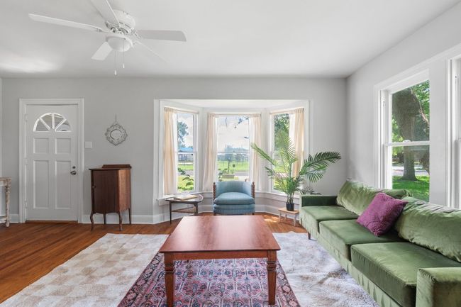 View of living room from arched dining entry to front door | Image 5