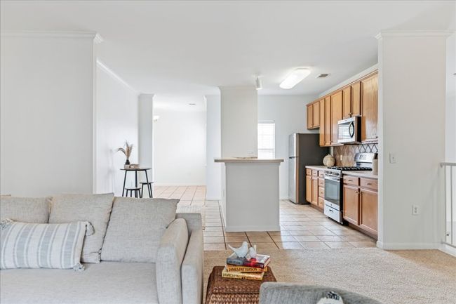 The kitchen is situated in the heart of the home. | Image 7