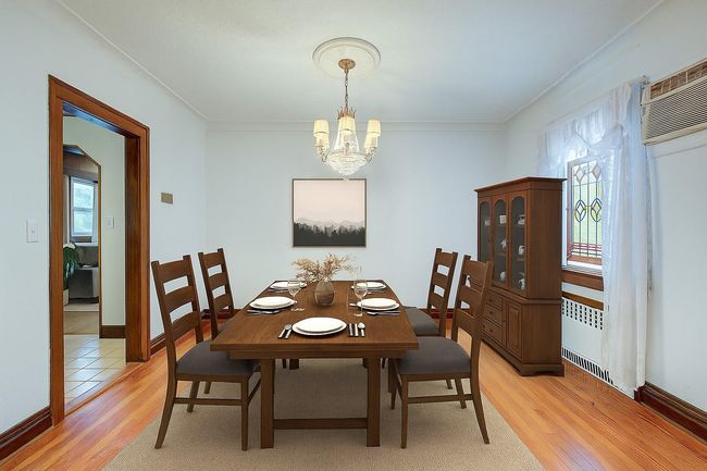 Dining space with a chandelier, light wood-type flooring, and crown molding | Image 8