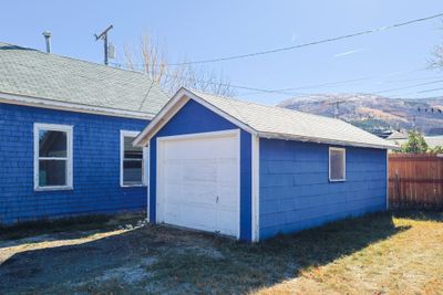 Garage featuring a mountain view and a yard | Image 3