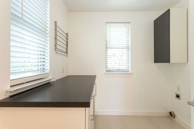 Laundry area with hookup for an electric dryer and plenty of natural light | Image 20