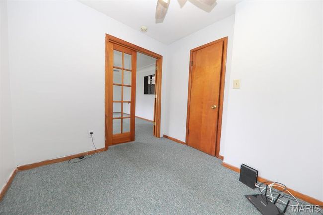 Spare room with baseboards, ceiling fan, and carpet | Image 16