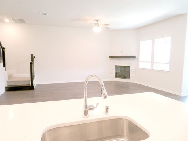 A view of the family room from the kitchen​​‌​​​​‌​​‌‌​‌‌​​​‌‌​​‌‌​‌​​​​​‌ island | Image 16