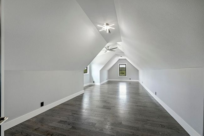 While the main floor also provides a dedicated home office with French doors (not pictured), upstairs you will also find this large bonus room. | Image 27