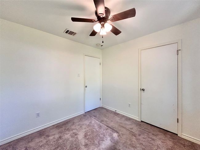 Unfurnished bedroom featuring carpet flooring and a ceiling fan | Image 13