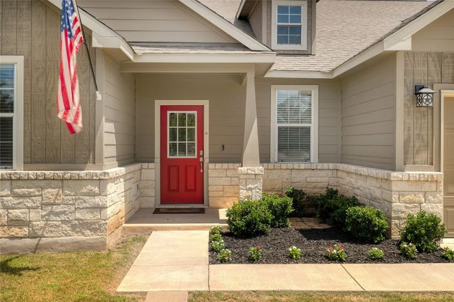 You'll be greeted with a gorgeous landscaping and that gorgeous exterior door. | Image 6
