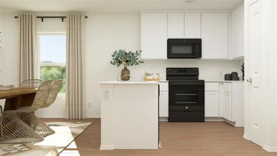 Kitchen featuring light hardwood / wood-style floors, white cabinetry, and black appliances | Image 3