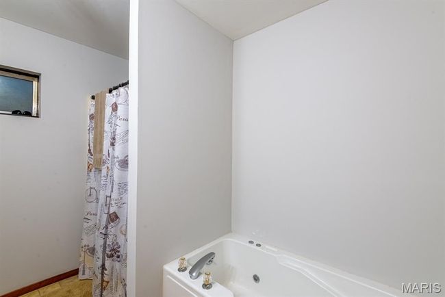 Full bathroom featuring a tub with jets | Image 16