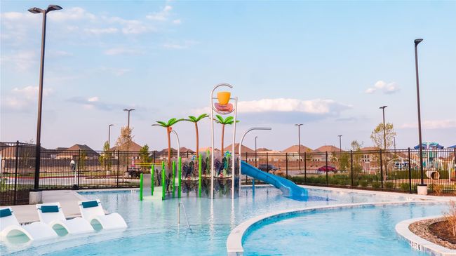 Lounge nearby while the kids play at the water playground. | Image 29