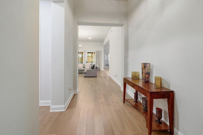 Hall featuring light wood-style flooring and baseboards | Image 15