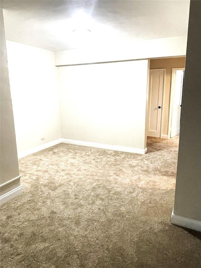 Carpeted empty room featuring baseboards | Image 5