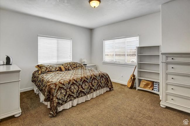 Carpeted bedroom with baseboards and visible vents | Image 13