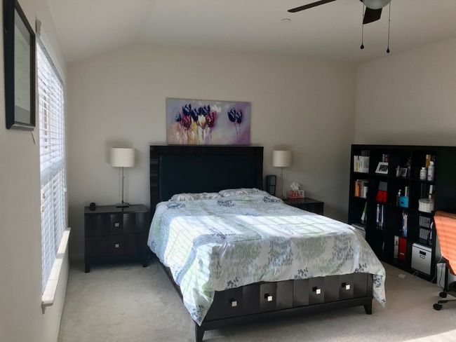 Carpeted bedroom with ceiling fan and vaulted ceiling | Image 8