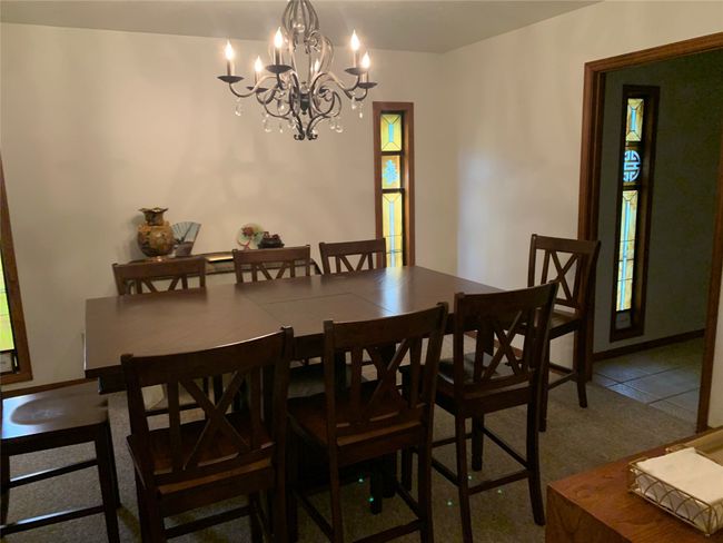 Dining space featuring a chandelier | Image 4
