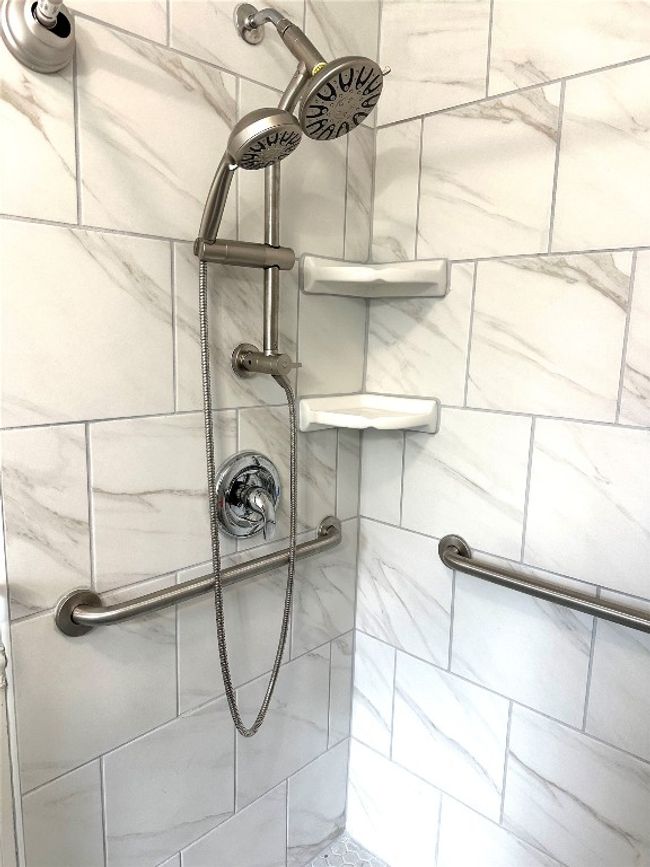 Detailed view of tiled shower | Image 15