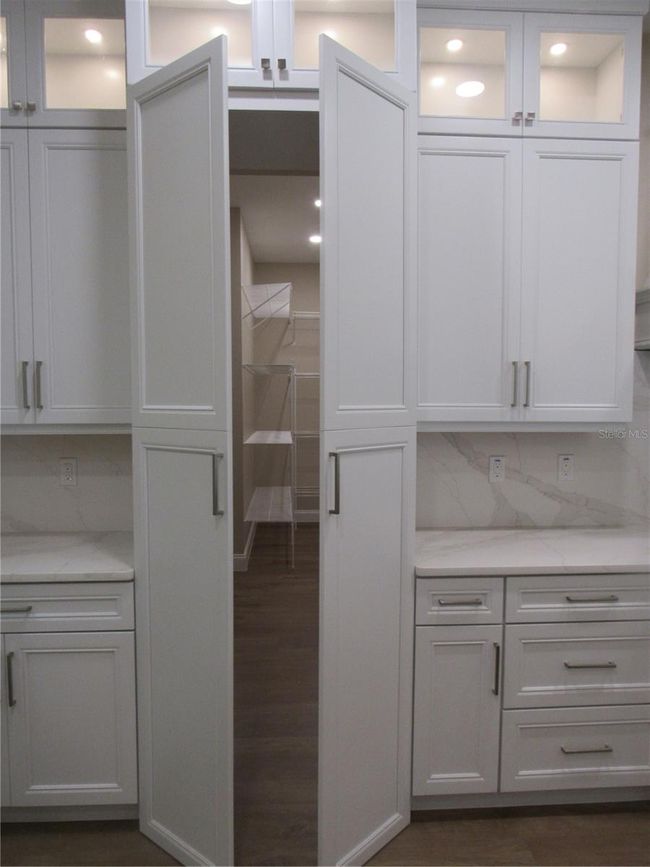 concealed walk in pantry | Image 21