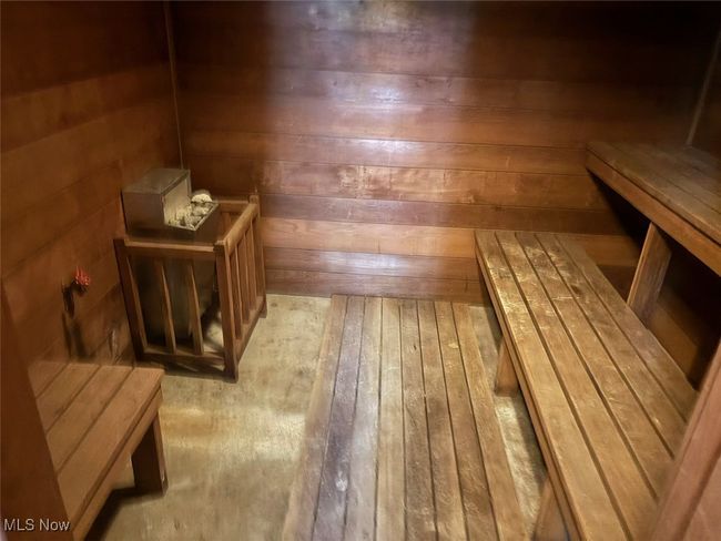 Relaxing sauna featuring wooden walls | Image 11