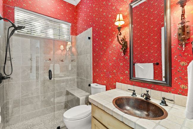 Full bath downstairs off of the entry and just outside the downstairs bedroom. | Image 20