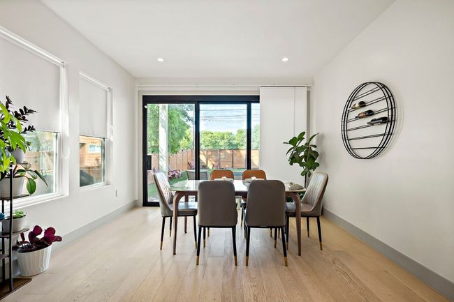 Dining space featuring baseboards, light wood finished floors, and recessed lighting | Image 12