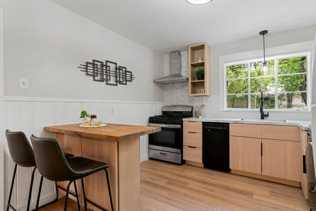 A look at the perfectly placed kitchen window that crafts picturesque backyard views. | Image 8