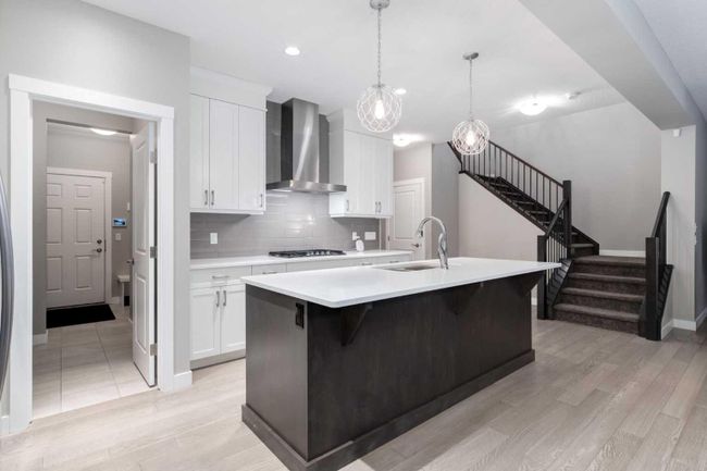 242 West Grove Point Sw, Home with 4 bedrooms, 3 bathrooms and 4 parking in Calgary AB | Image 6