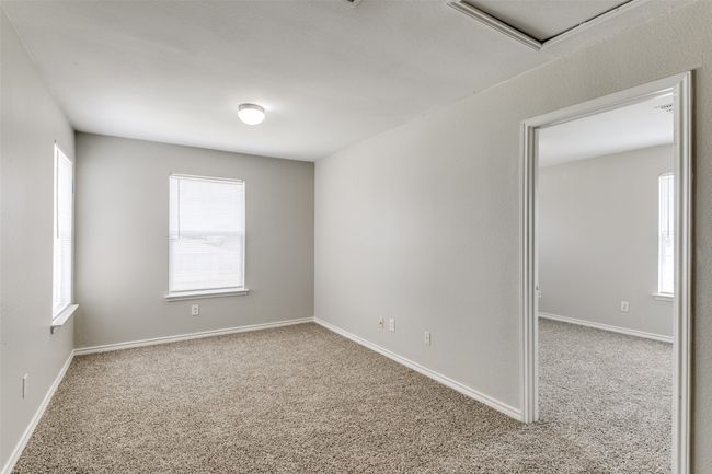 View of carpeted spare room | Image 15