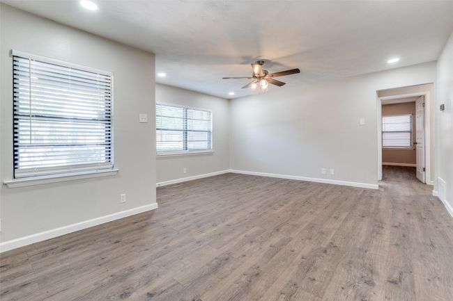 Empty room featuring a ceiling fan, recessed lighting, and wood finished floors | Image 19