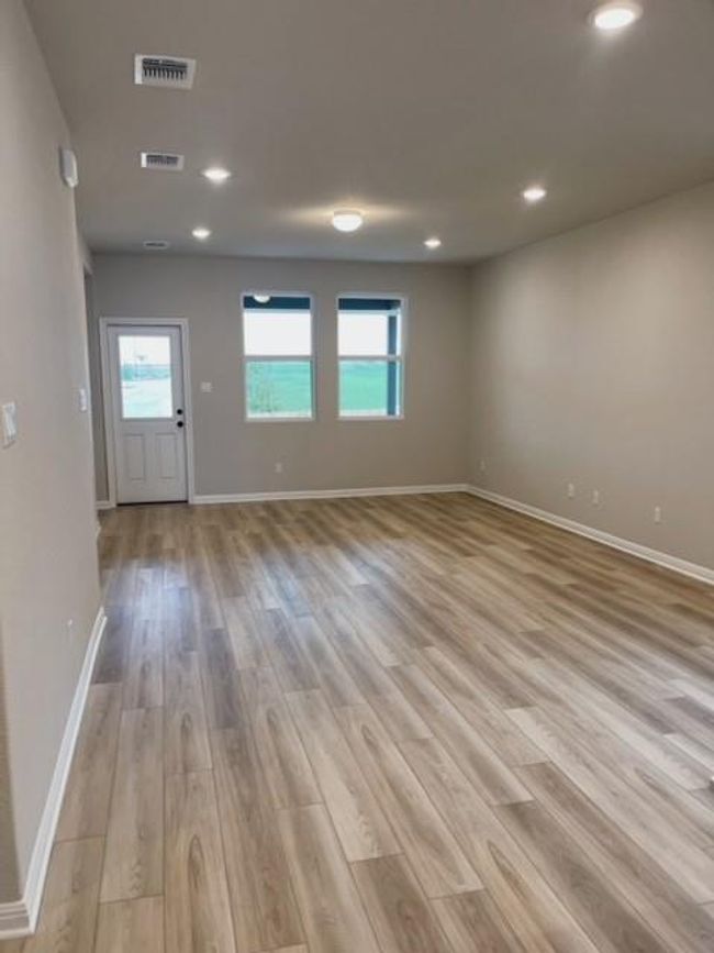 Empty room featuring light wood-style flooring and recessed lighting | Image 4