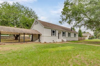 View of front of house featuring a carport and a front lawn | Image 3