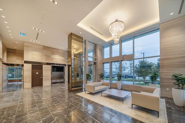 Building lobby featuring a towering ceiling | Image 24