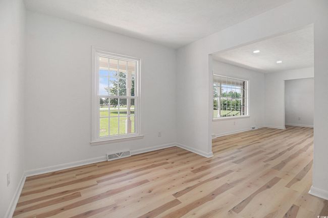 Open Concept View of Dining and/or Flex Room and Living Room with lots of natural light. | Image 12