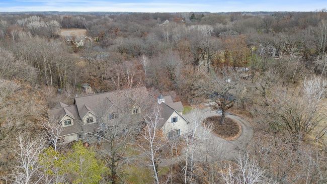 Wider view showing house, lawn, woods with mature trees. Very private. | Image 64