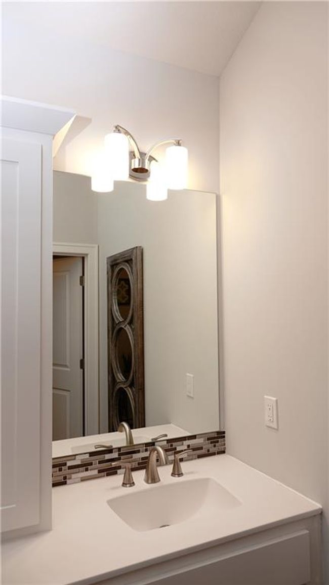 Bathroom featuring tasteful backsplash and vanity | Image 39