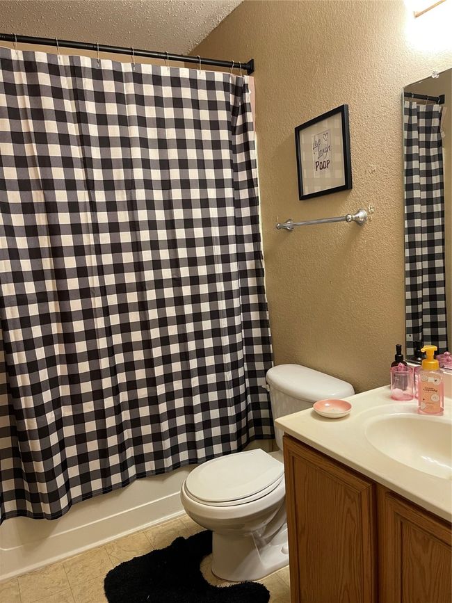 Bathroom, vanity, and shower / bathtub combo | Image 13