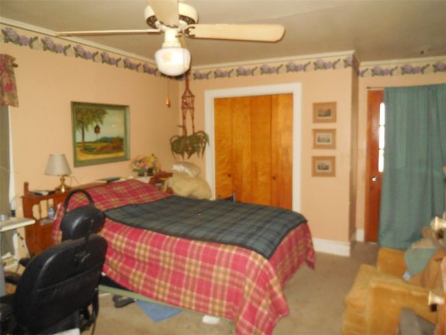 Carpeted bedroom featuring baseboards and a ceiling fan | Image 10