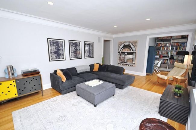 Large corner living room has recess lighting, built-in speaker system, hardwood floors and a nook that is a great place for an office. The living room is 20'-7" x 13'-3" The office nook is an additional 8'-9" x 6'-9". | Image 5