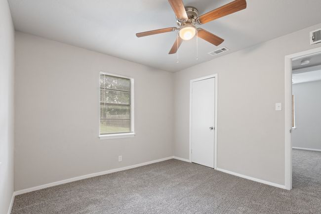 Unfurnished bedroom with carpet floors and ceiling fan | Image 18